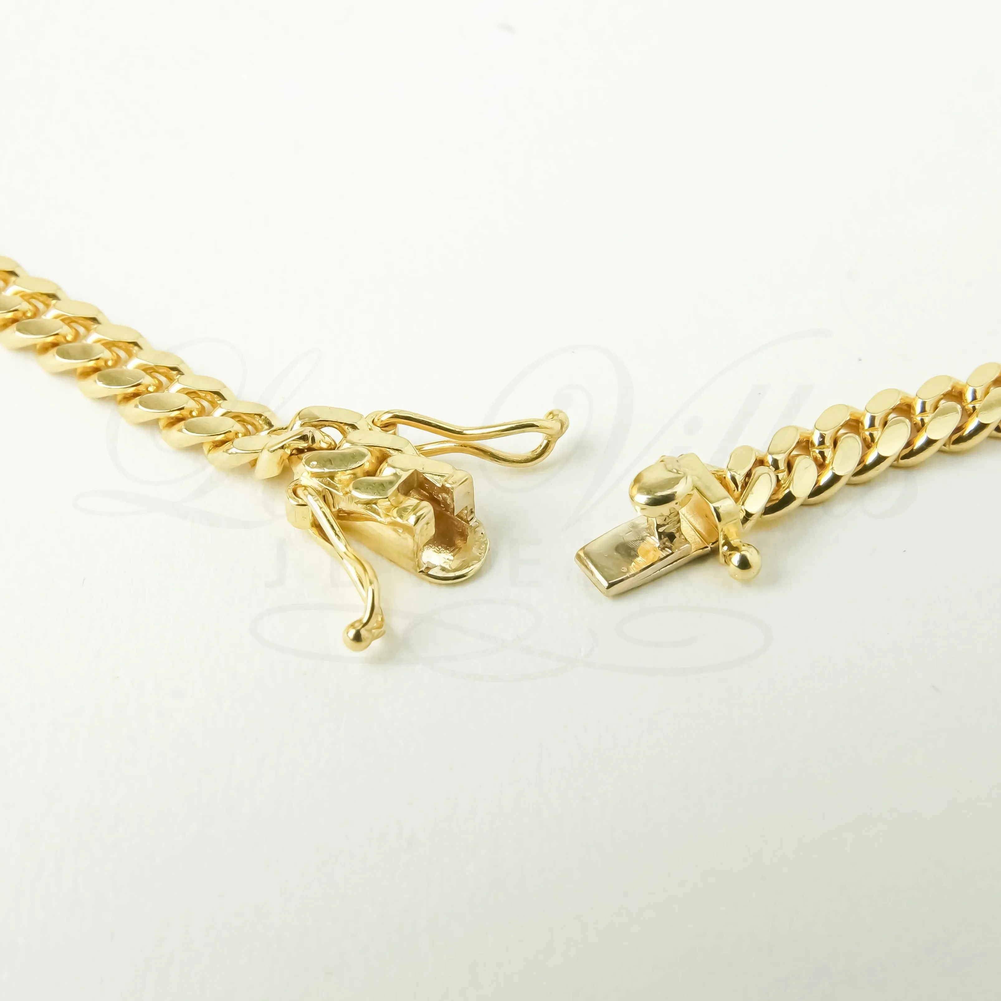 5.7mm machine-made solid Cuban Link Chain in 10K Gold