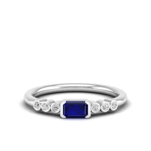 East-West Sapphire and Bezel Diamond Ring