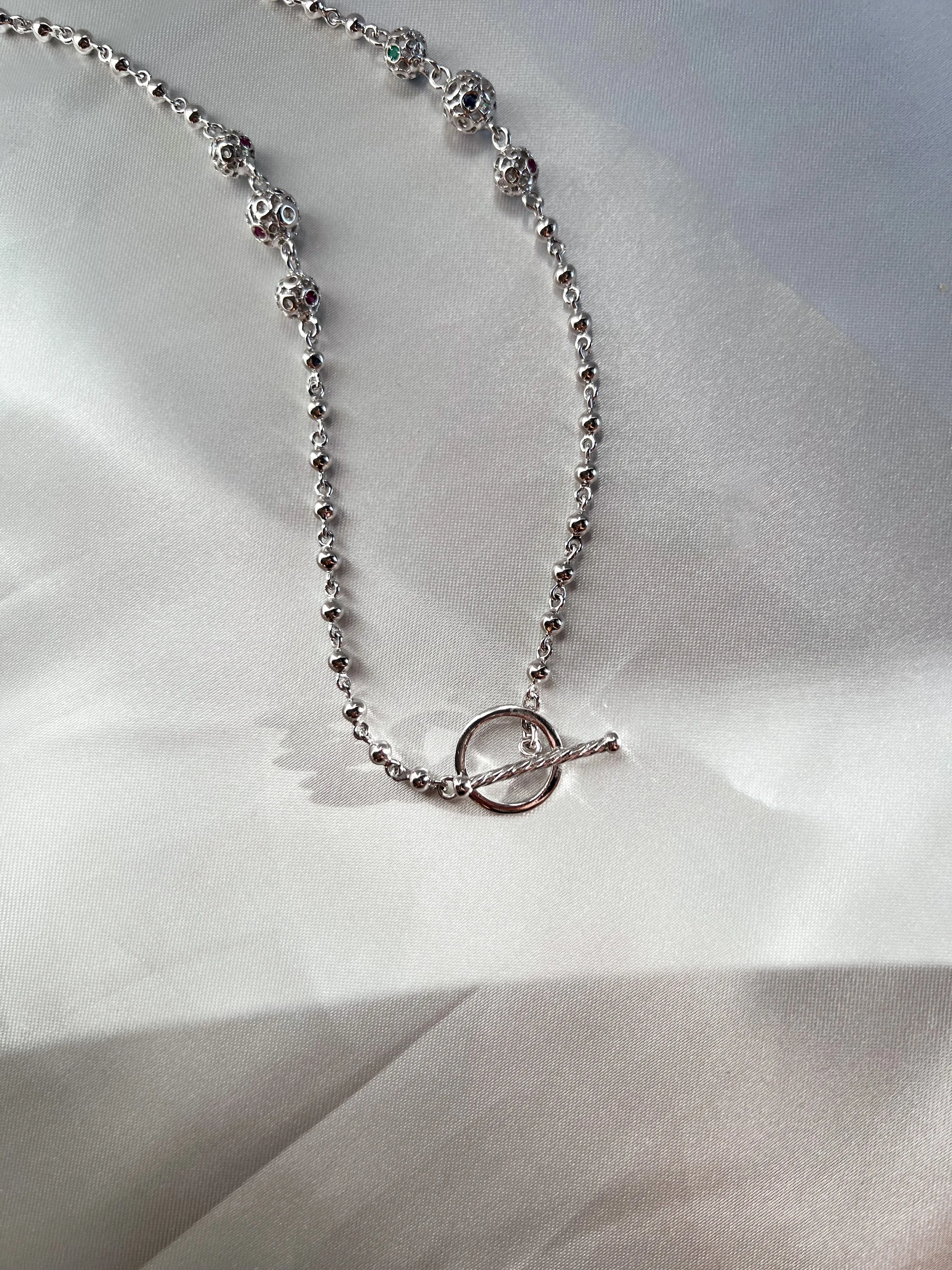 Retrograde Silver Jeweled Beads Necklace