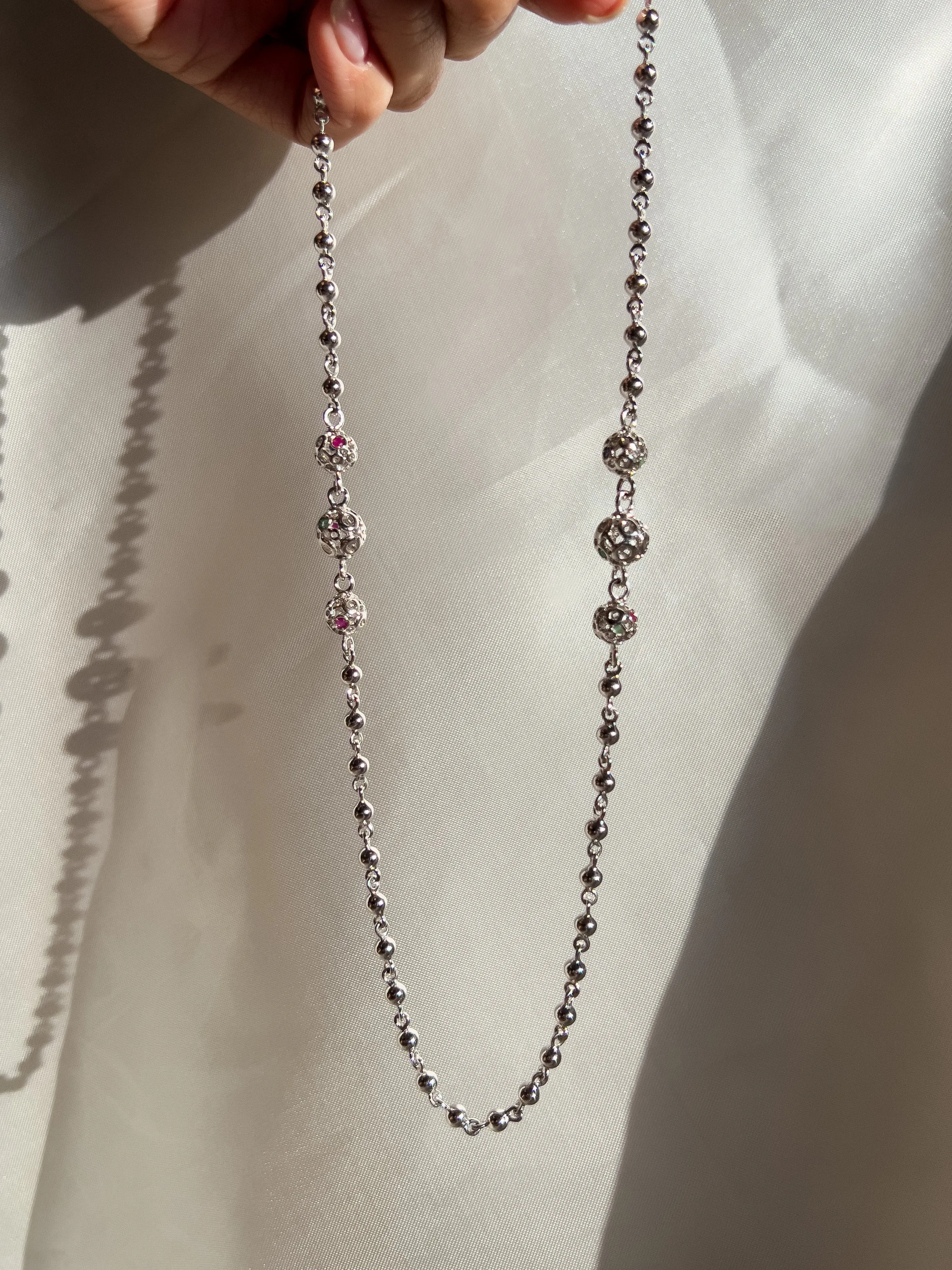 Retrograde Silver Jeweled Beads Necklace