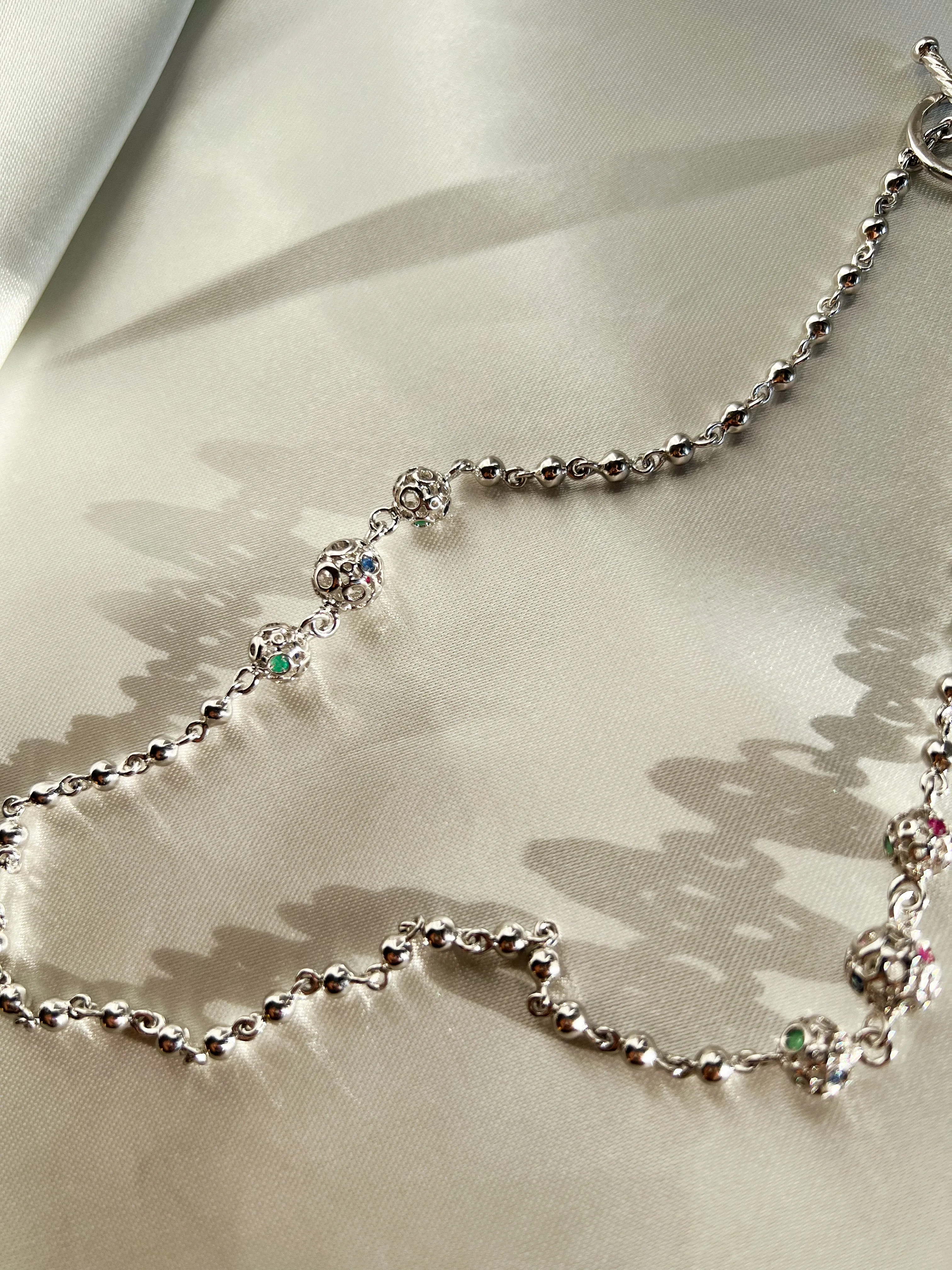 Retrograde Silver Jeweled Beads Necklace