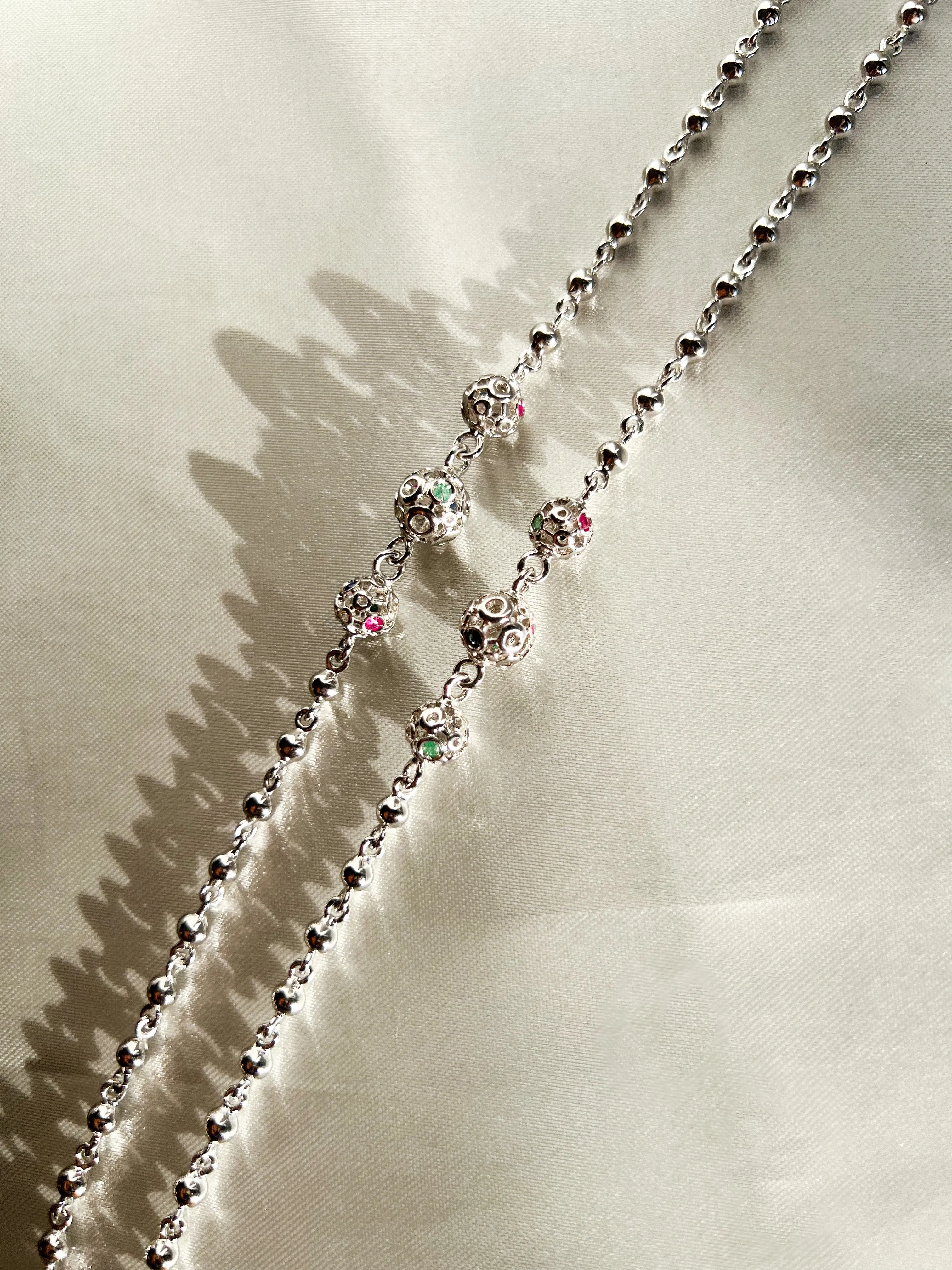 Retrograde Silver Jeweled Beads Necklace